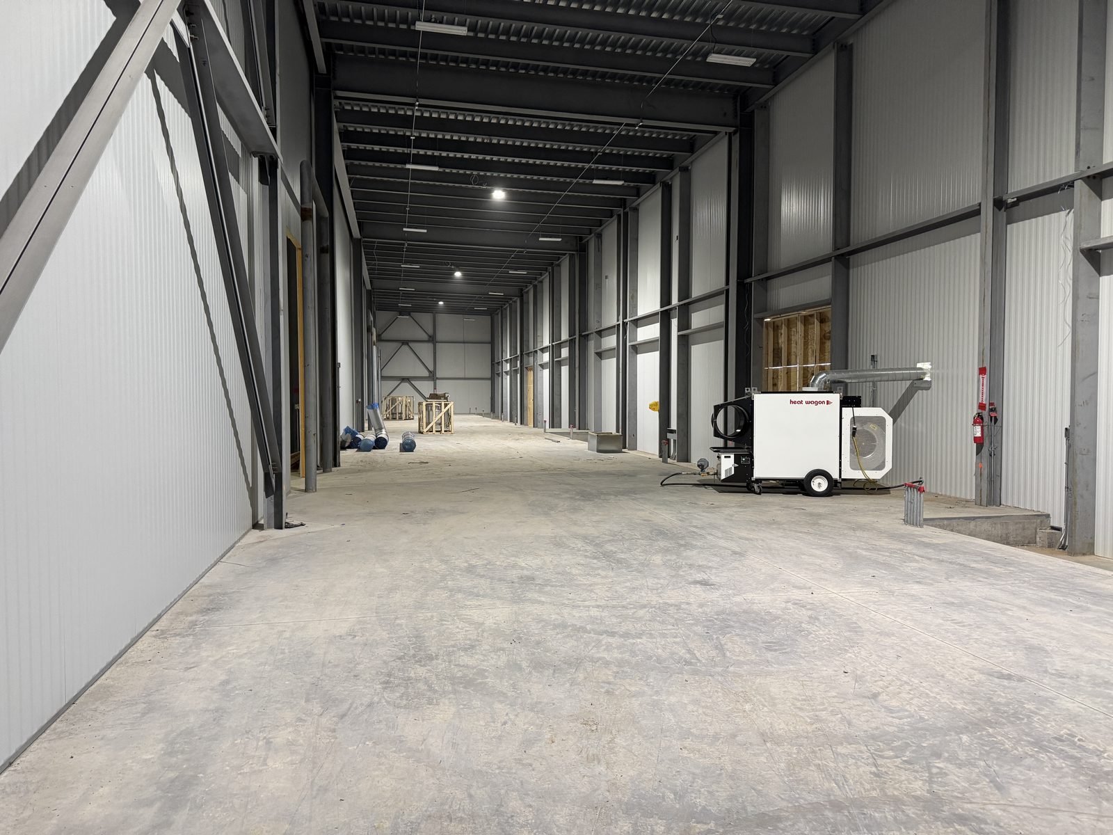 Heat Wagon indirect-fired heater installed in a steel building bay