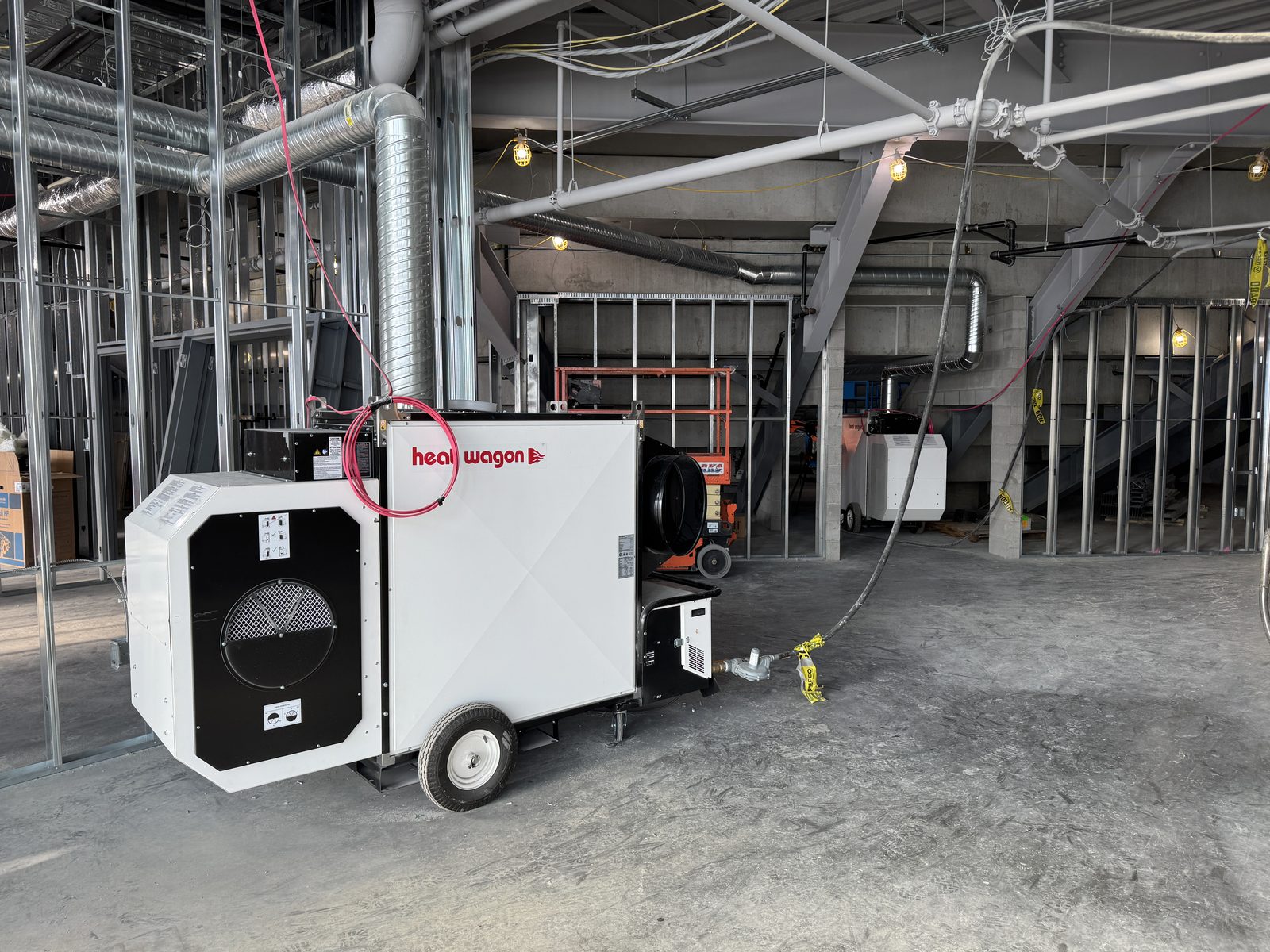 Heat Wagon indirect heater running inside a building during interior framing